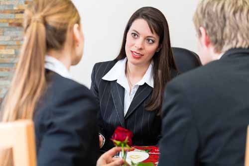 A funeral director meets with clients
